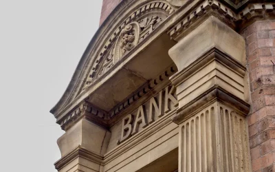 SEO for Banks Blog Post Feature Image Historic bank building facade with stone columns and “BANK” sign, illustrating SEO for banks and local SEO for banks.